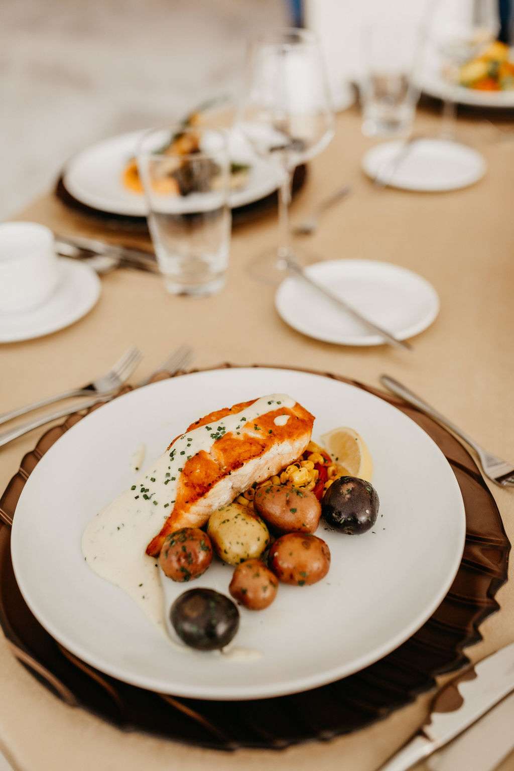 Pan-Roasted Atlantic Salmon served with heirloom potatoes and sweet corner by Resonance Food Co at Bradley Symphony Center. Pan-Roasted Atlantic Salmon served with heirloom potatoes and sweet corner by Resonance Food Co at Bradley Symphony Center.