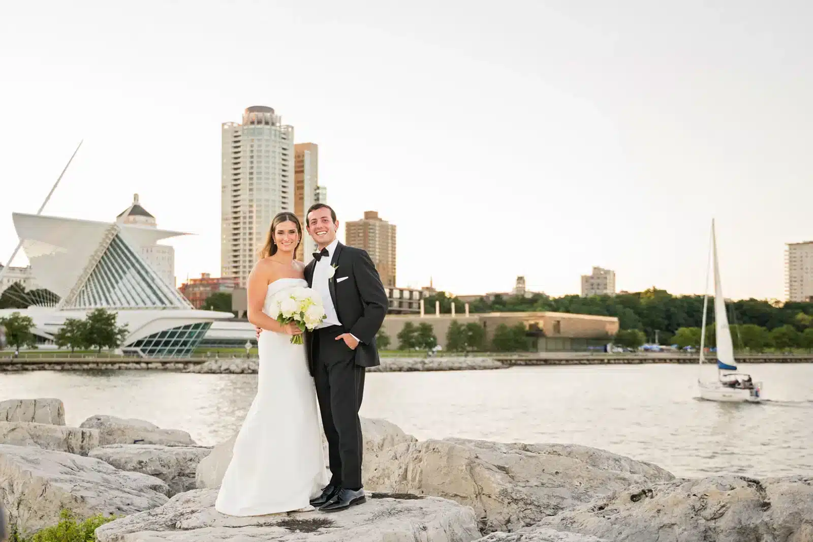 Bride and Groom with the Milwaukee lakefront behind them. Bride and Groom with the Milwaukee lakefront behind them.