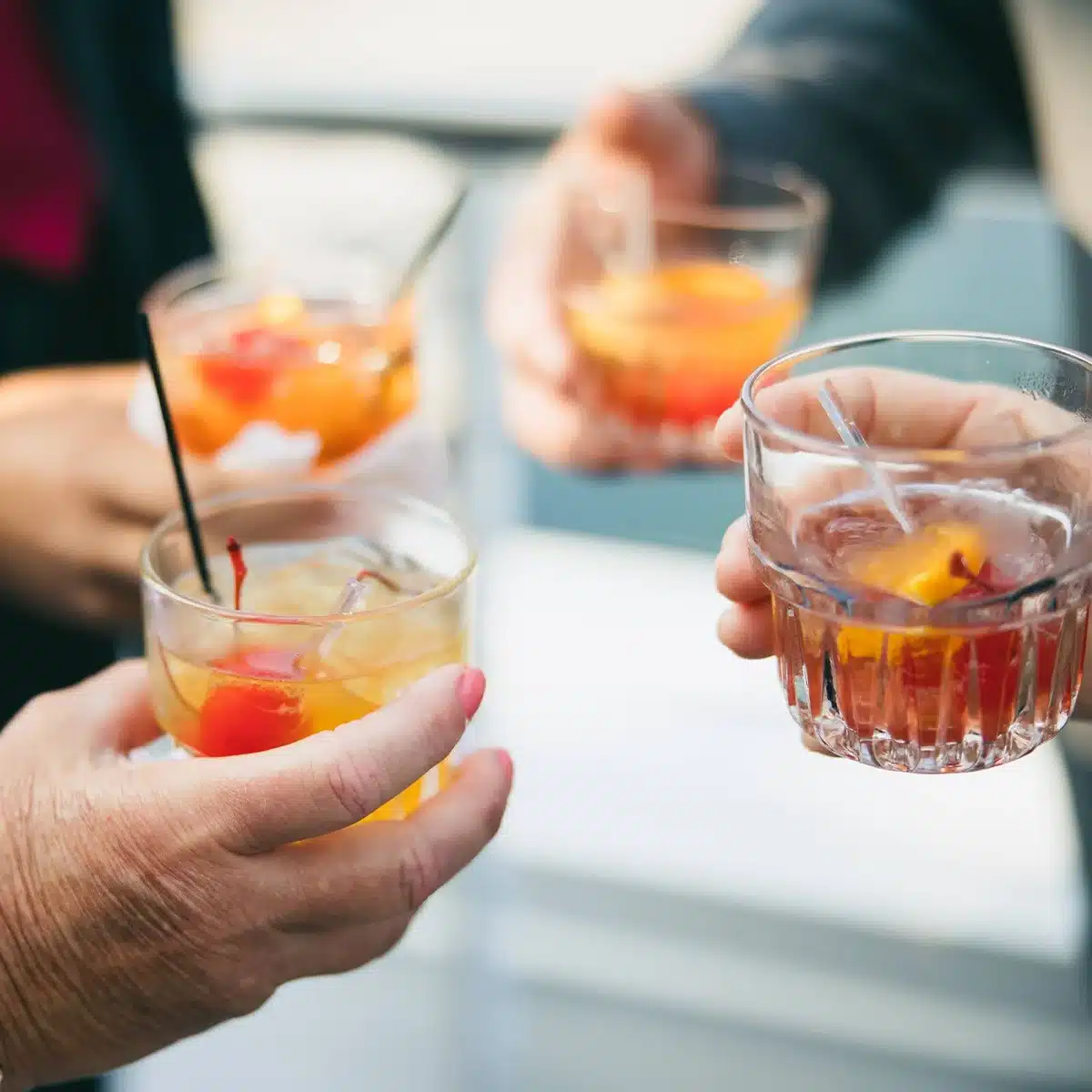 Guests cheersing cocktails by Barolottas.