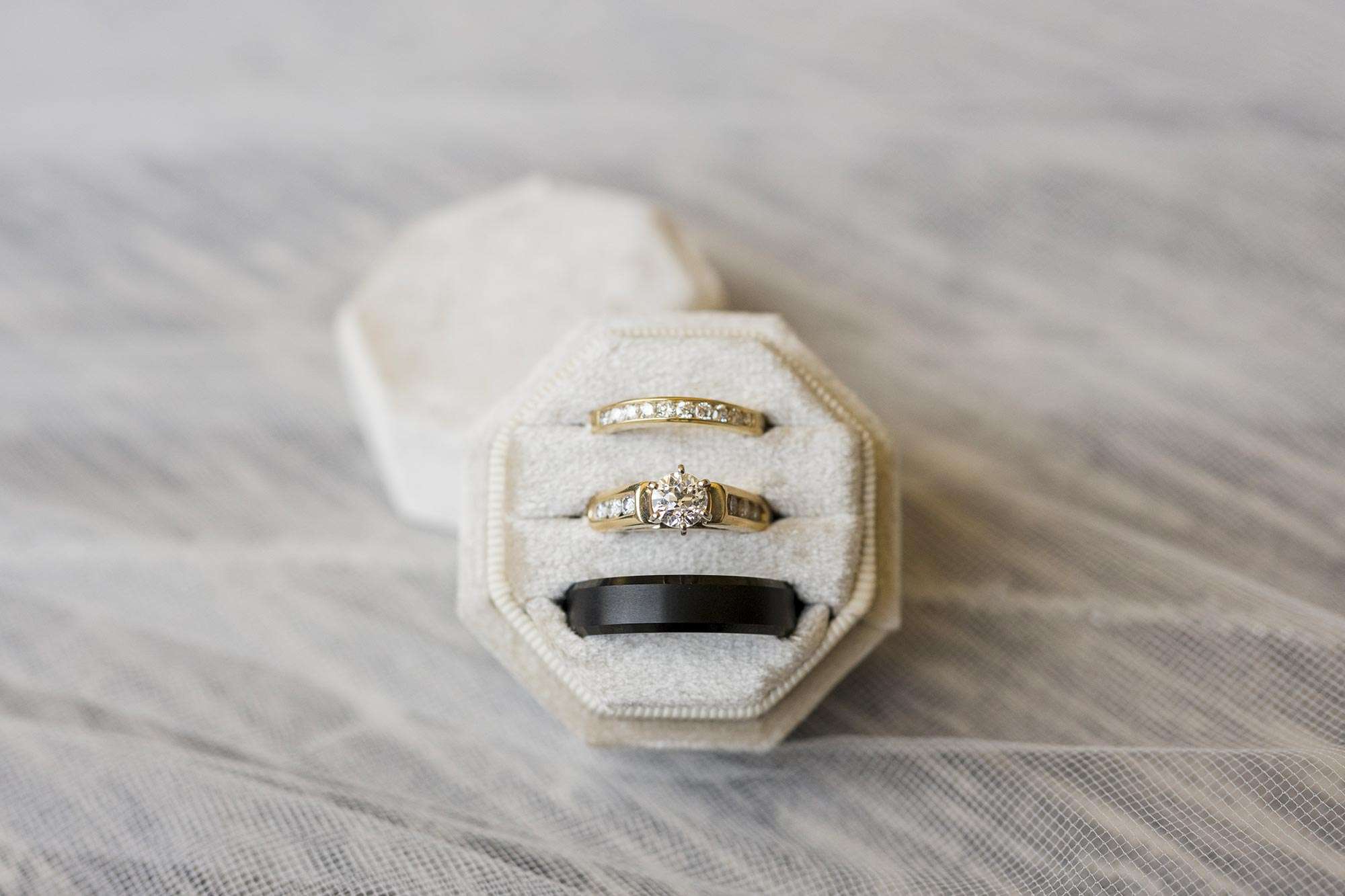 ashley-and-jack-jan-serr-studio-allysha-noelle-photography-25 gold wedding ring/band & black graphite band by Powers Goldsmith in velvet box