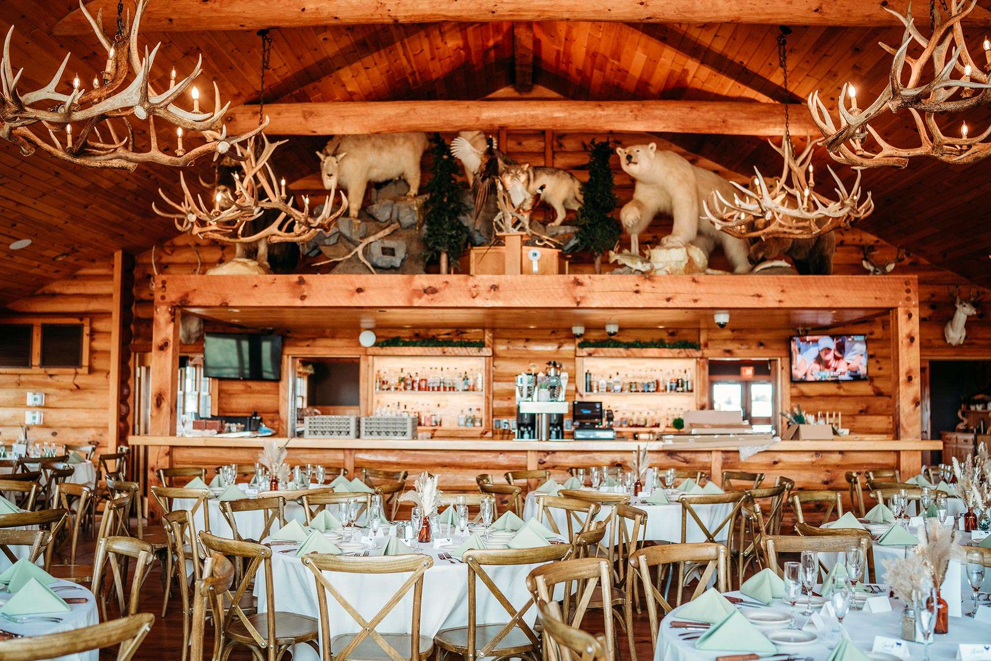 dinner tables set in rustic bar area at Milford Hills dinner tables set in rustic bar area at Milford Hills