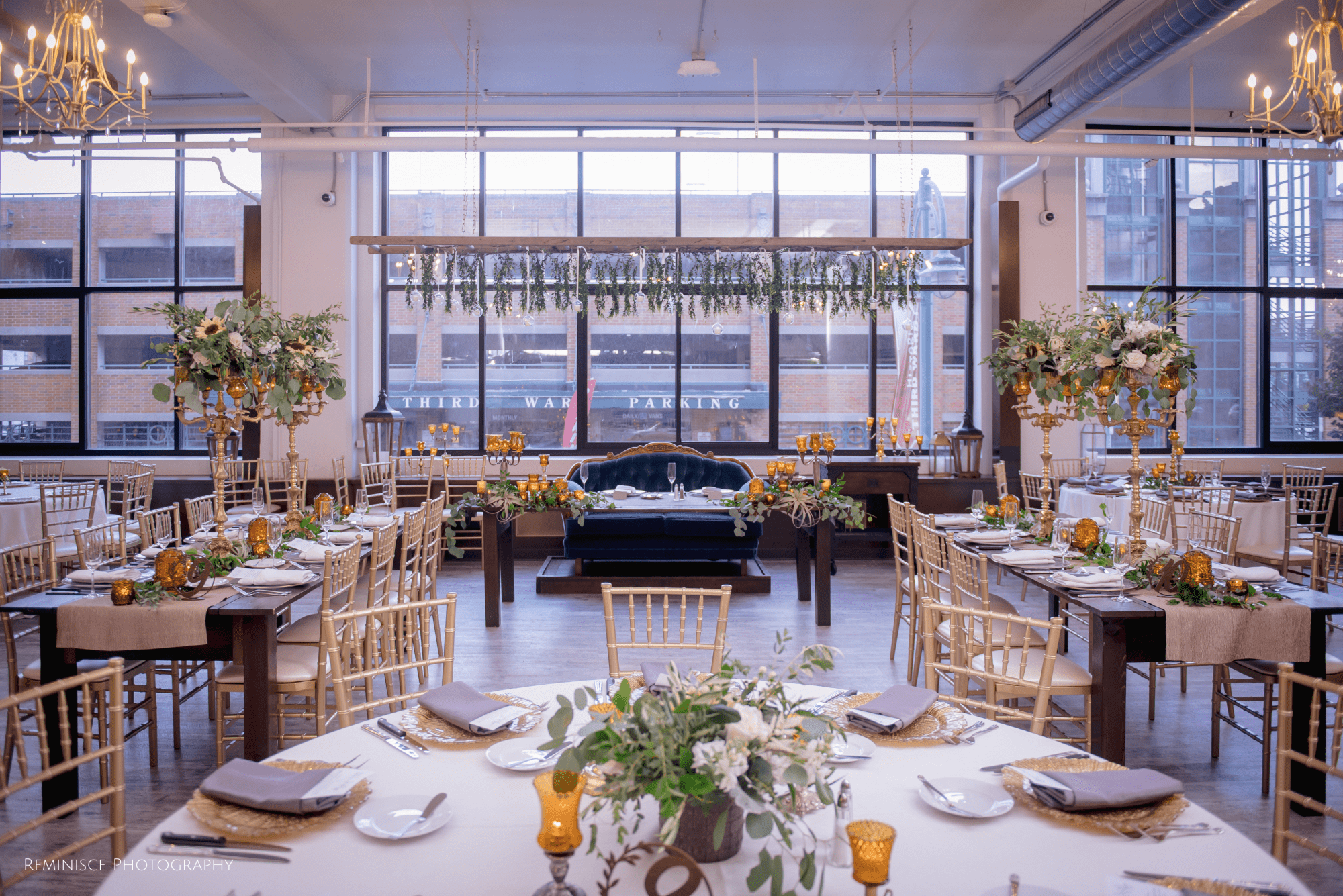 Pearl and Cade’s wedding featured an elegant sweetheart table and golden decor under cascading greenery at a chic industrial venue. Pearl and Cade’s wedding featured an elegant sweetheart table and golden decor under cascading greenery at a chic industrial venue.