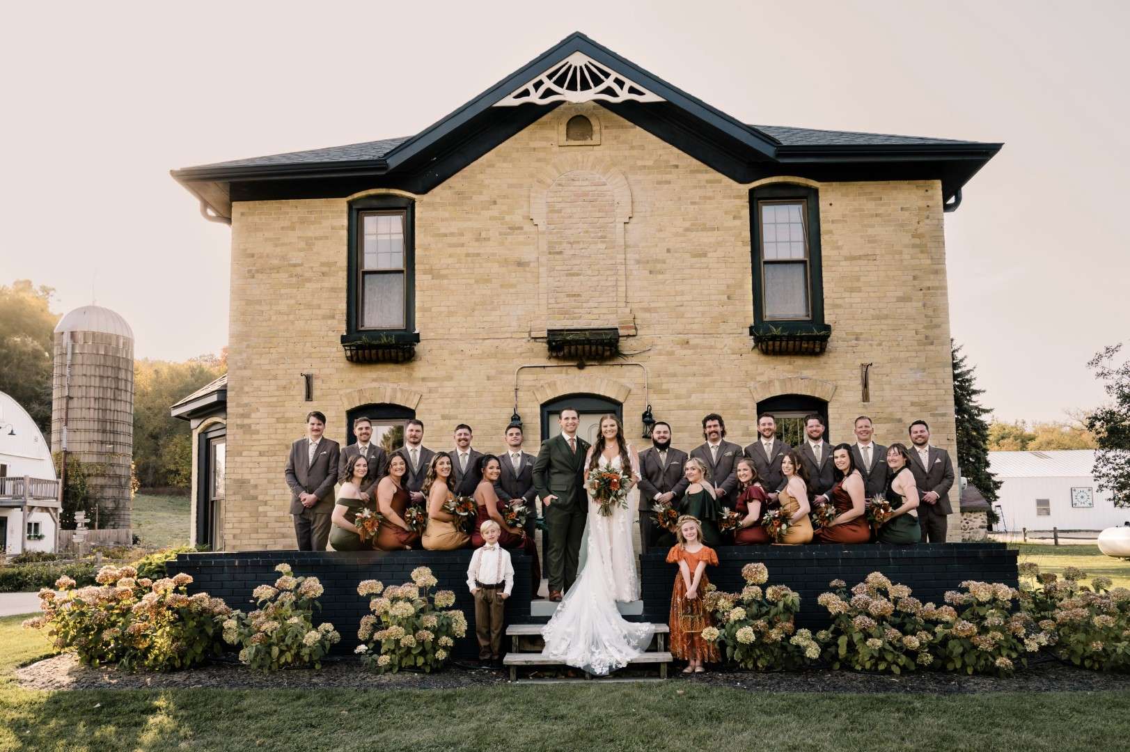 Wedding party outside the home on the property of The Bowery Barn.