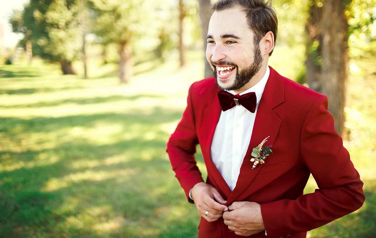Groom in Red Jacket