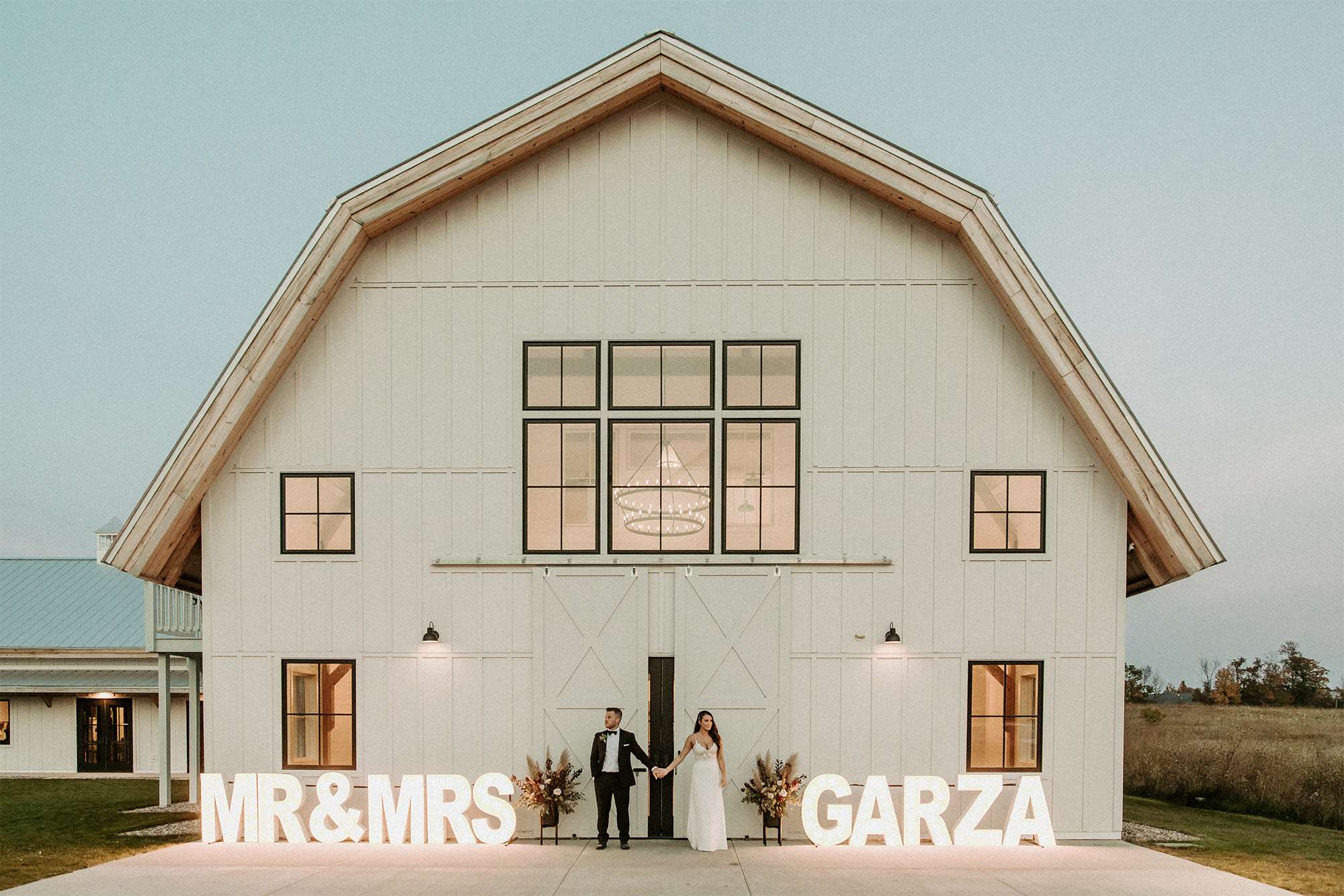 Neon Mr and Mrs sign in front of Northern Haus Sister Bay Alpha Lit Green Bay