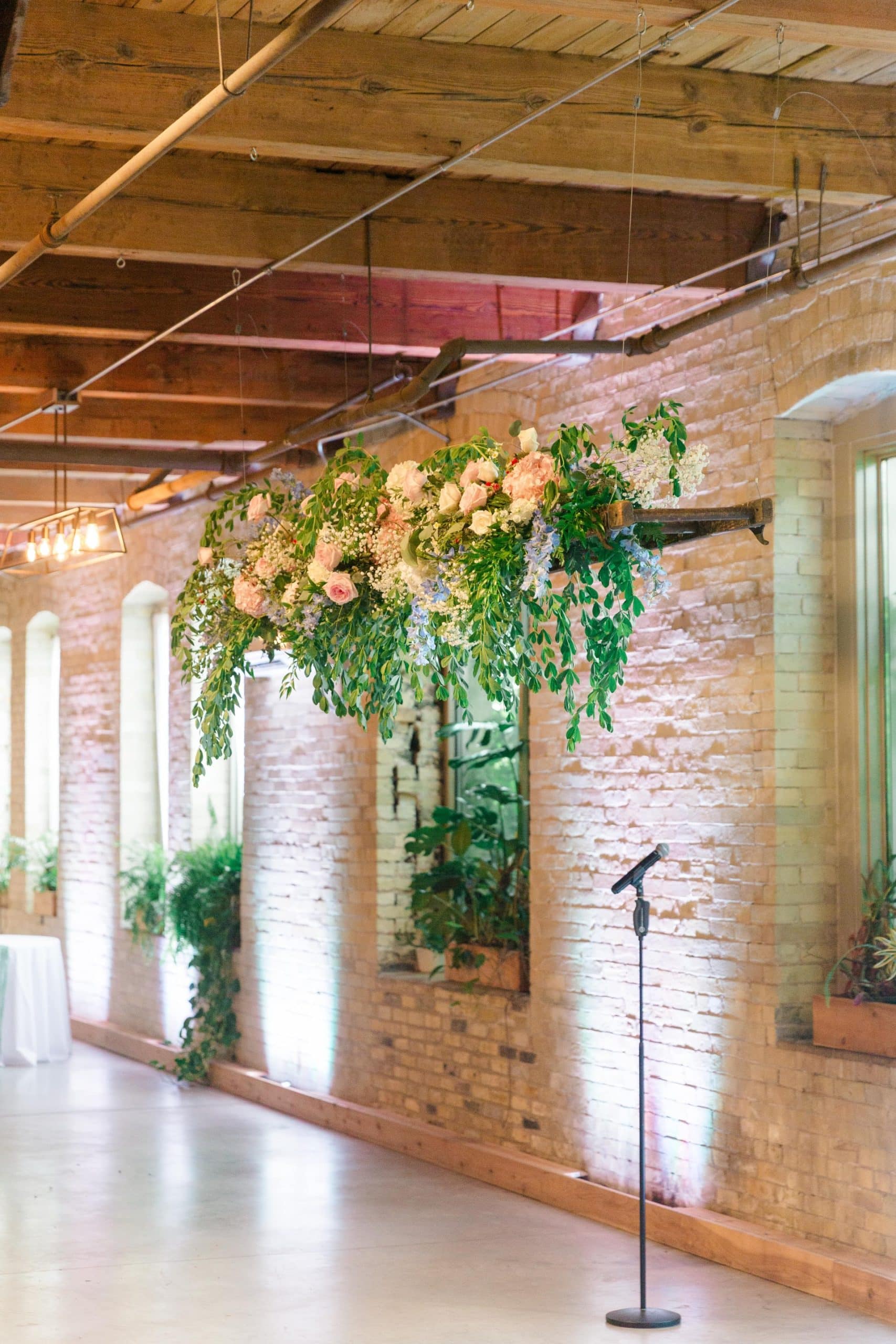 Azar Milwaukee setup for wedding ceremony with floral backdrop.