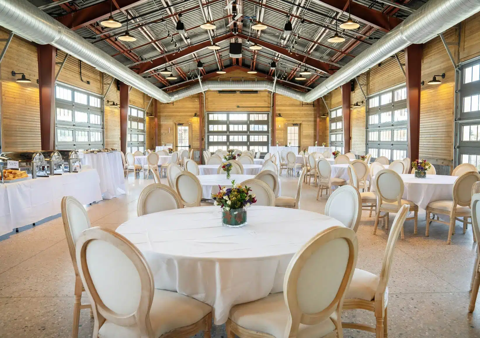 Foxtown Station Wedding venue in Graftron Wisconsin featuring glass garage doors. Foxtown Station Wedding venue in Graftron Wisconsin featuring glass garage doors.