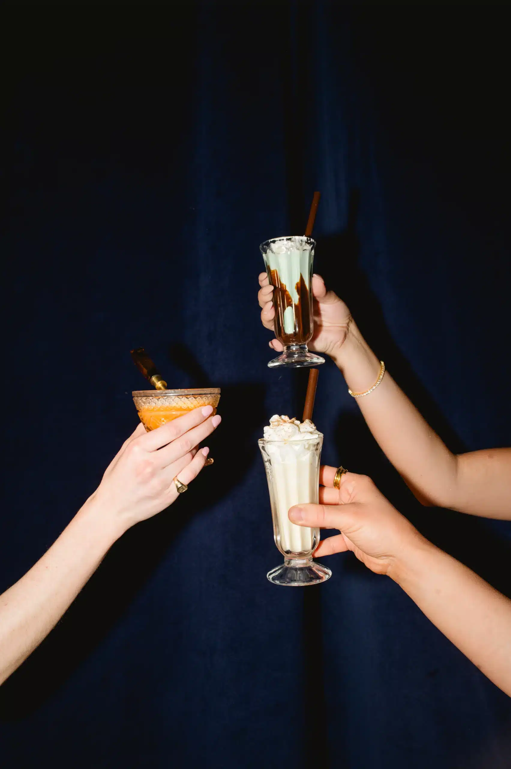 Ice Cream Desserts held up by hands for a specialty event. Ice Cream Desserts held up by hands for a specialty event.