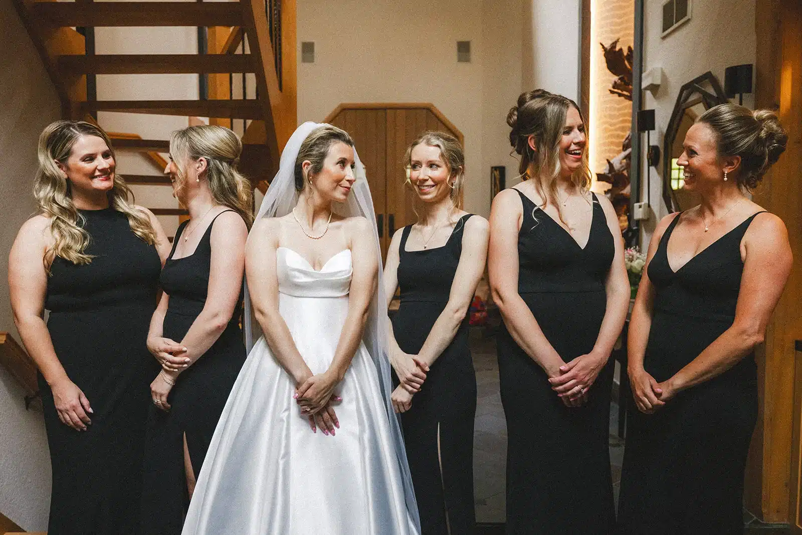 Bride and her bridesmaids in the back of the church waiting for their wedding ceremony. Bride and her bridesmaids in the back of the church waiting for their wedding ceremony.
