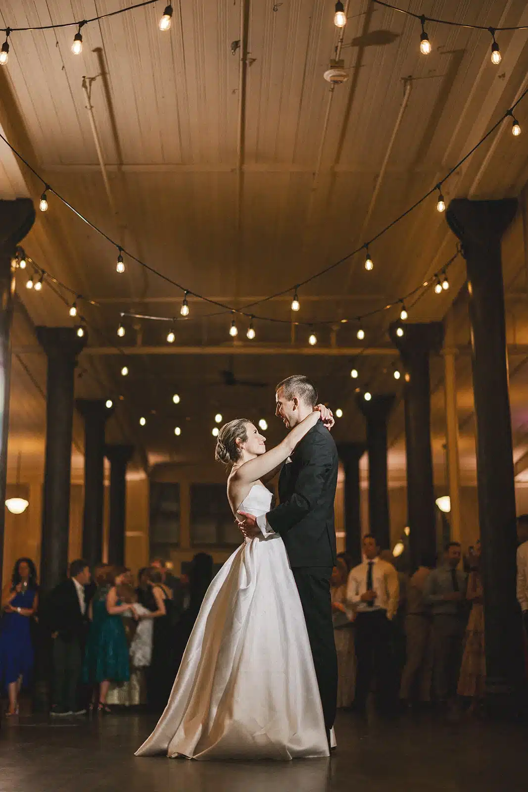 Bride and groom dancing for their first dance at The Pritzlaff building in Milwaukee, WI. Bride and groom dancing for their first dance at The Pritzlaff building in Milwaukee, WI.