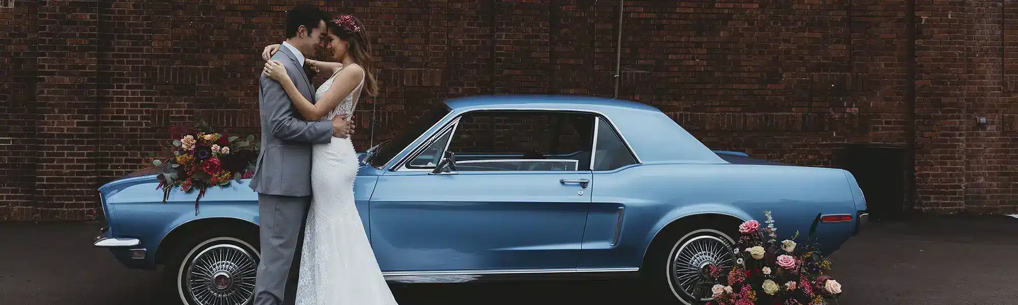 Groom standing by classic car by Abigail Miles Photography Transportation