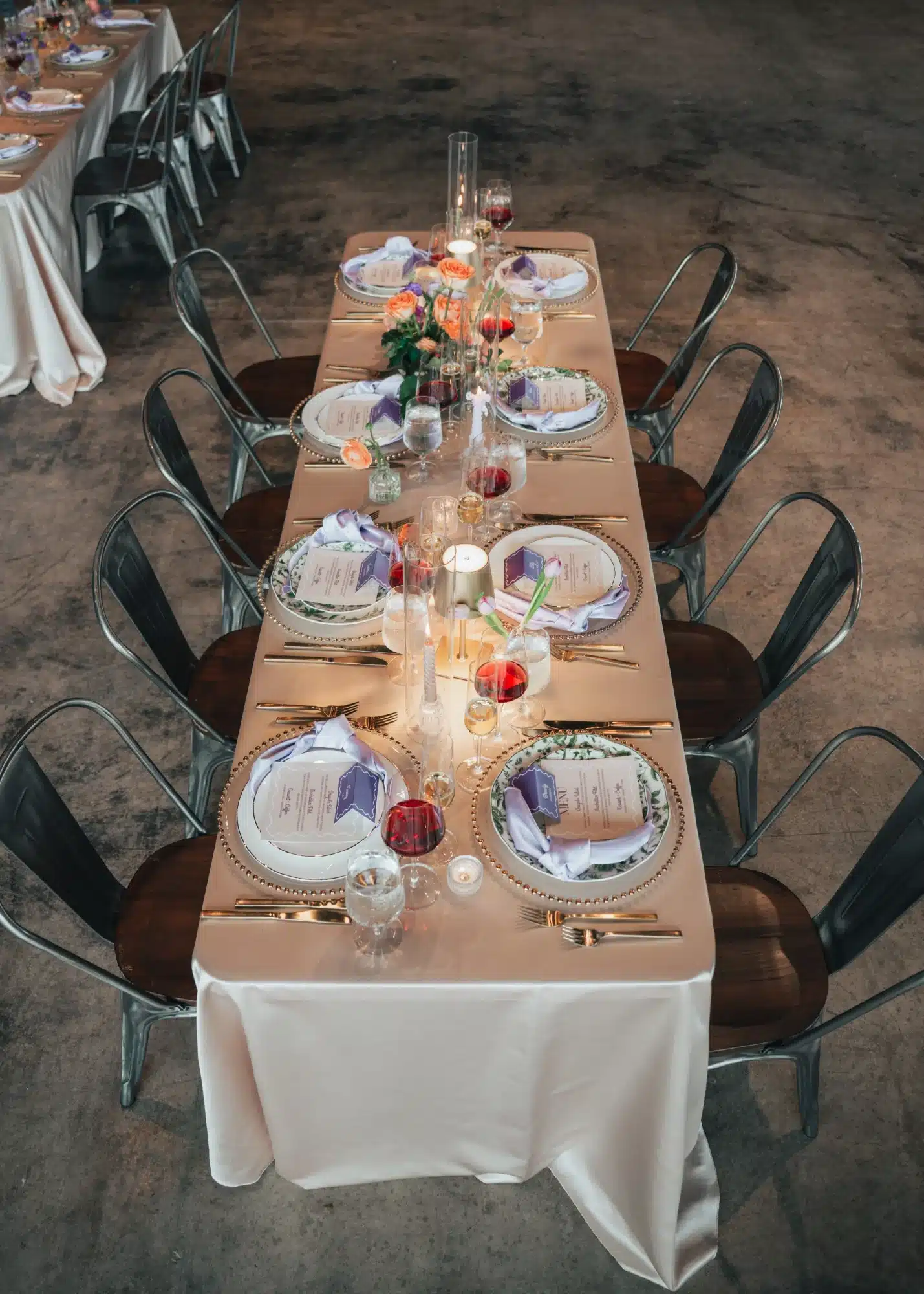 Reception table setup for a purple and coral styled shoot by Celebrait by Kait. Reception table setup for a purple and coral styled shoot by Celebrait by Kait.
