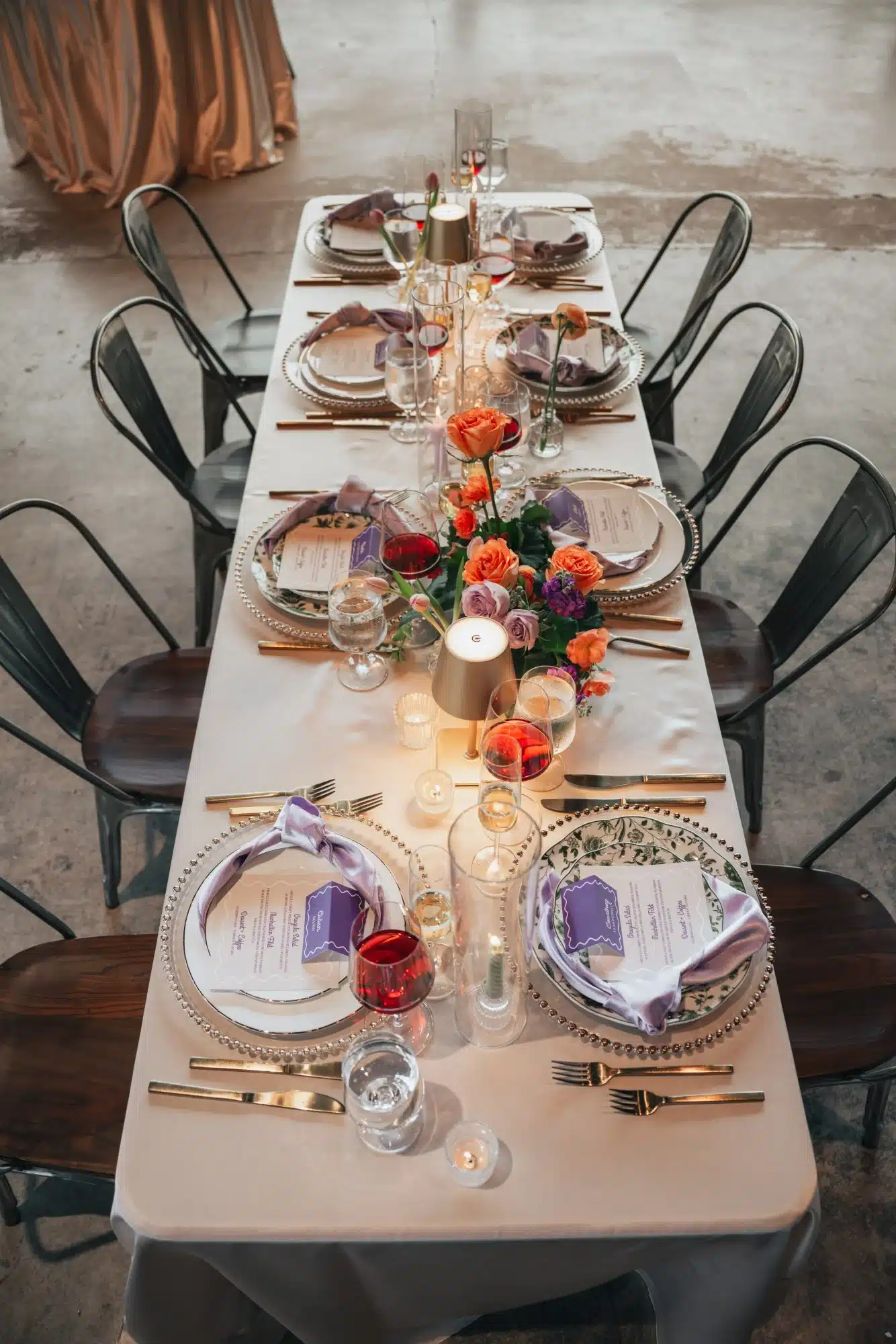 Reception table setup for a purple and coral styled shoot by Celebrait by Kait. Reception table setup for a purple and coral styled shoot by Celebrait by Kait.