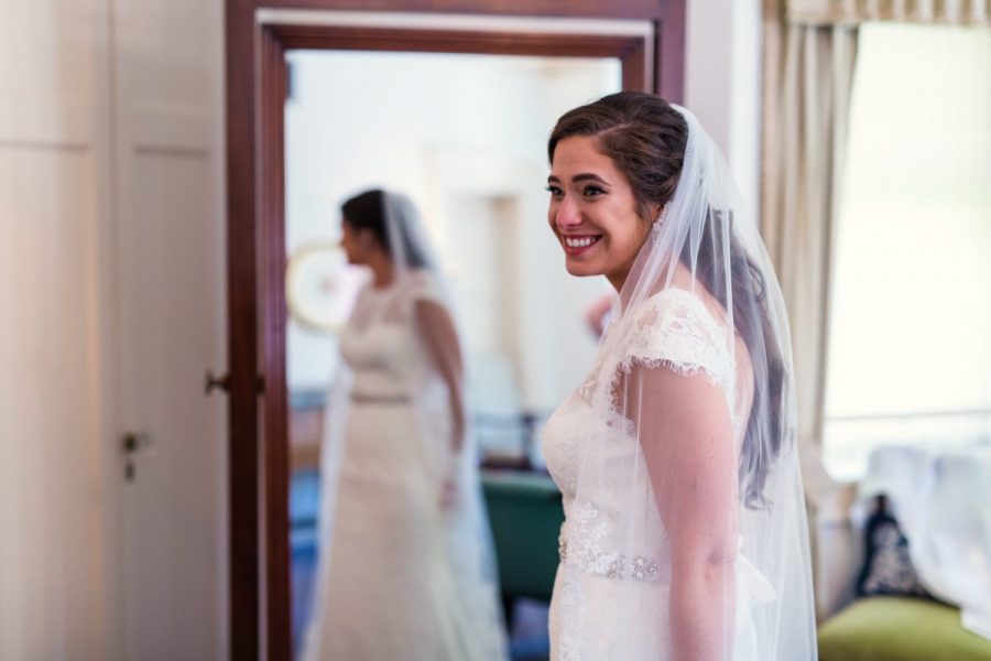 Bride with reflection in mirror at the Charles Allis Art Museum in Milwaukee, WI
