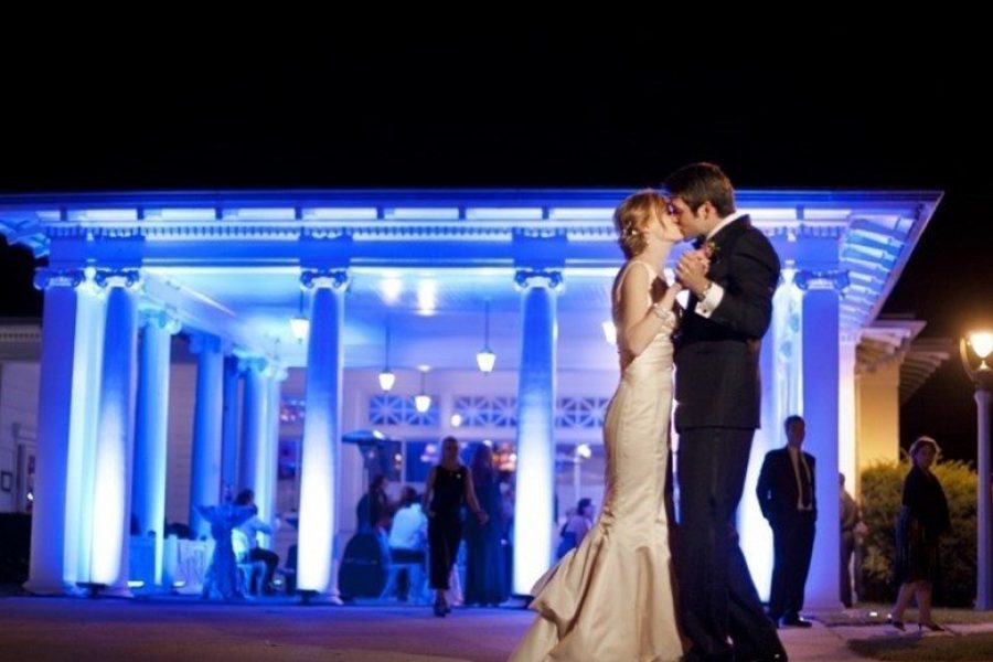 Bride and groom dance outside Lake Park Bistro in Milwaukee, WI at night with gorgeous lighting