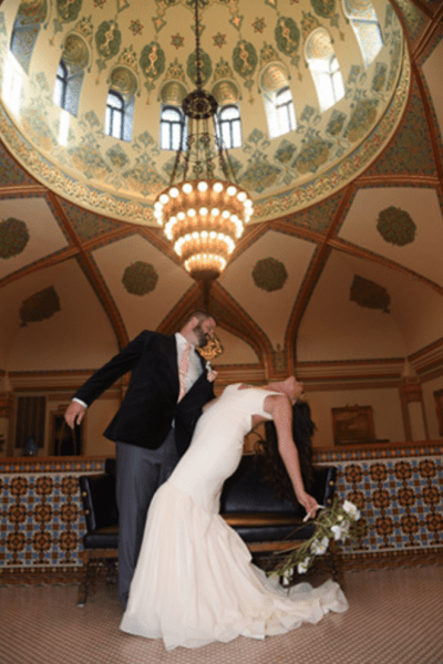 Groom dips bride at the Tripoli Shrine Center in Milwaukee, WI