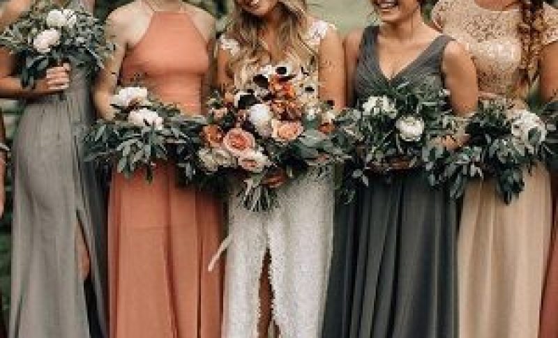 Bride and bridesmaids images dresses with floral bouquets.