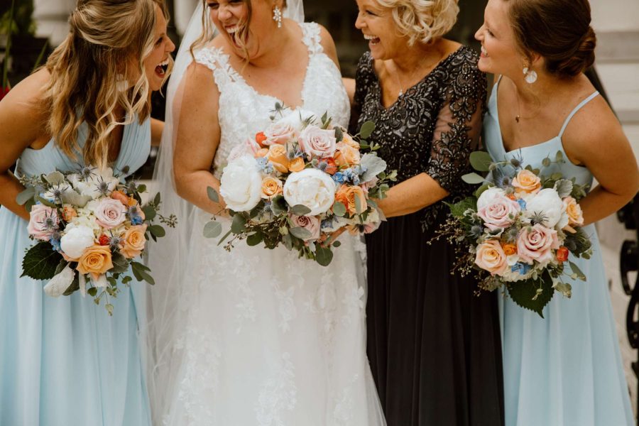 Touches of orange and blues designed specially for this bride by Bank of Flowers