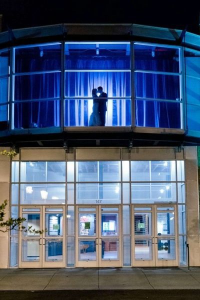 Silhouette of bride and grrom on second floor at the Schauer Arts Center