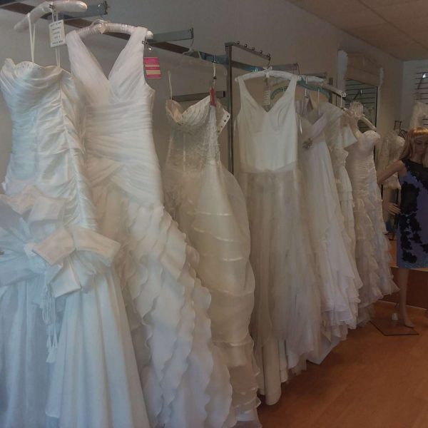 wedding dresses on a rack