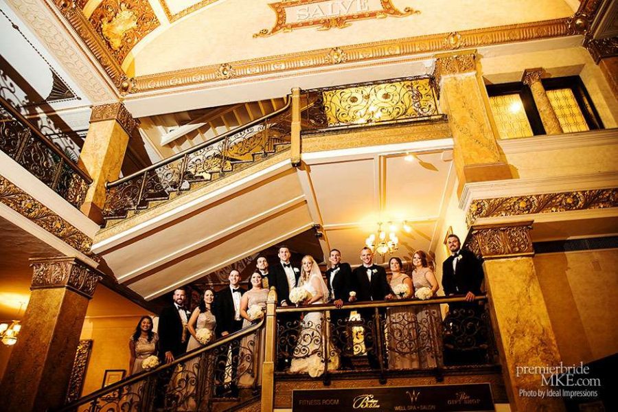 Wedding Party on Stairs for dramatic group image at historic hotel