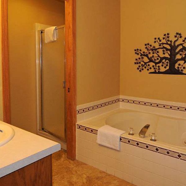 Bathroom with whirlpool tub at Newport Resort of Door County