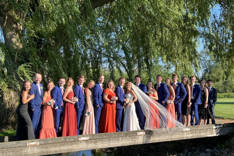 wedding party posing on golf course bridge at Watertown Country Club.