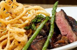 New York Strip with Haystack Onion prepared by Chef Feker