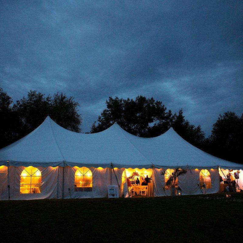 Warm glow of the wedding tent after sunset