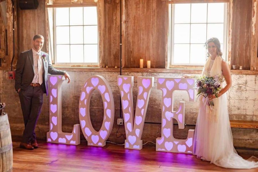 Lit LOVE sign at wedding