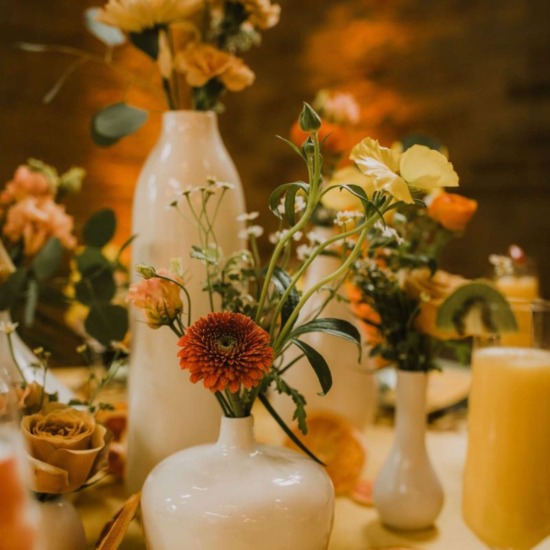 Centerpiece created by small bud vases. Photo by DeGroot Film Co.