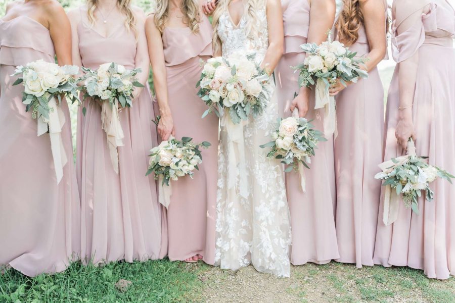 Bride and bridesmaid bouquets in light shades of pink by Magnolia Floral Market