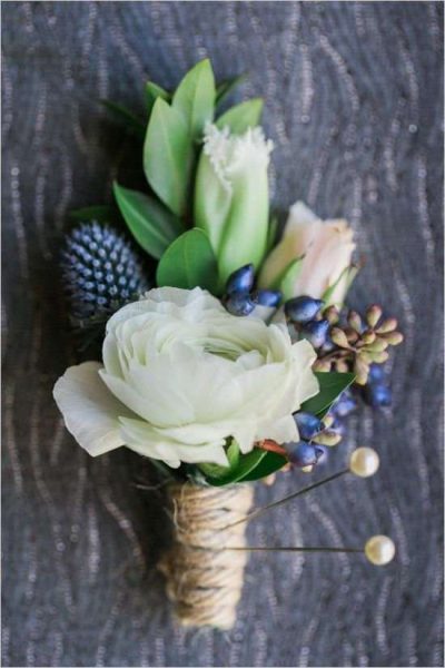 Rannunculus and berry boutonniere by Magnolia Floral Market