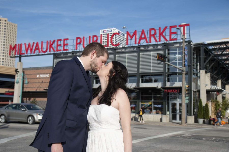 Bride and groom kiss outside of Milwaukee Public Market- Photo by Cream City Weddings