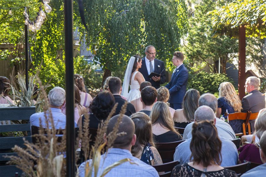 Bride and groom say vows at their Cream City Garden wedding in Milwaukee, WI.