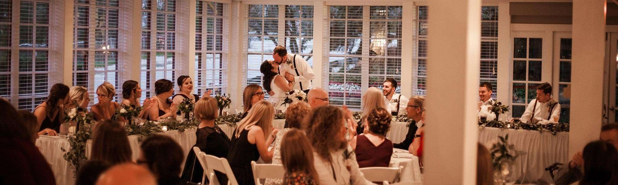 Bride and groom kiss at their Red Circle Inn wedding reception.