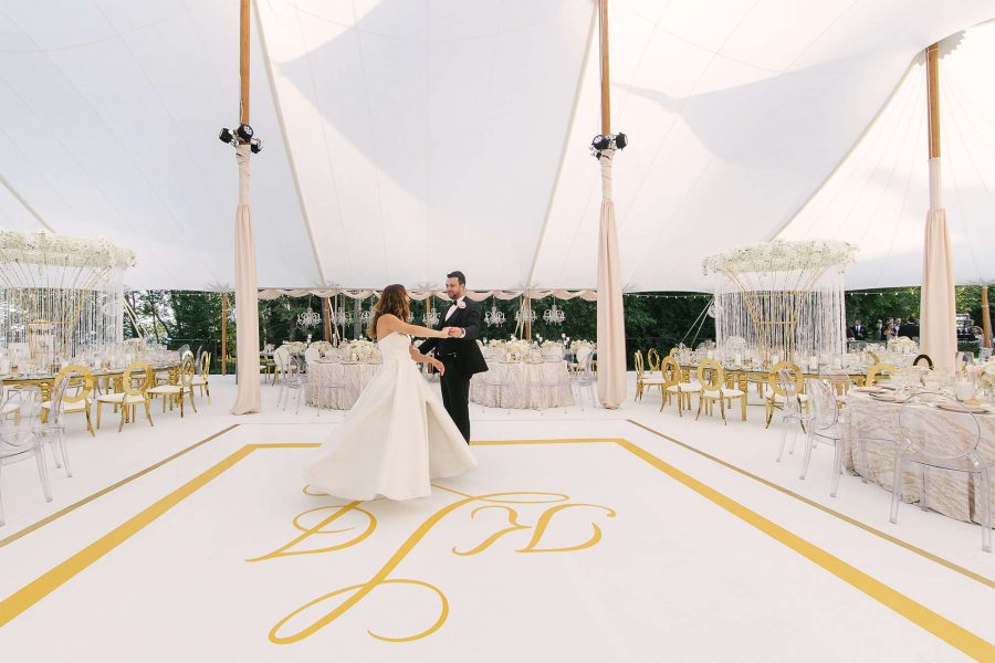 Bride and groom dance on custom dance floor by Mandel Graphic Solutions