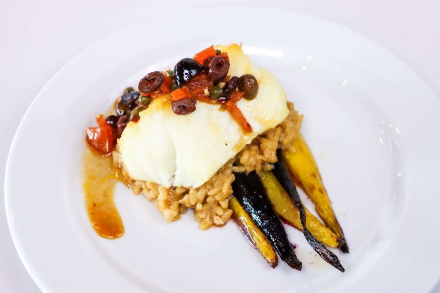 Striped Bass with Puttanesca Sauce Served with risotto milanese and choice of seasonal vegetable